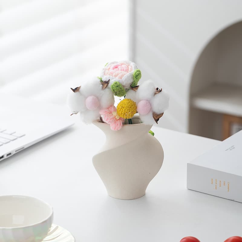 Small folded stoneware ceramic vase with colorful flowers