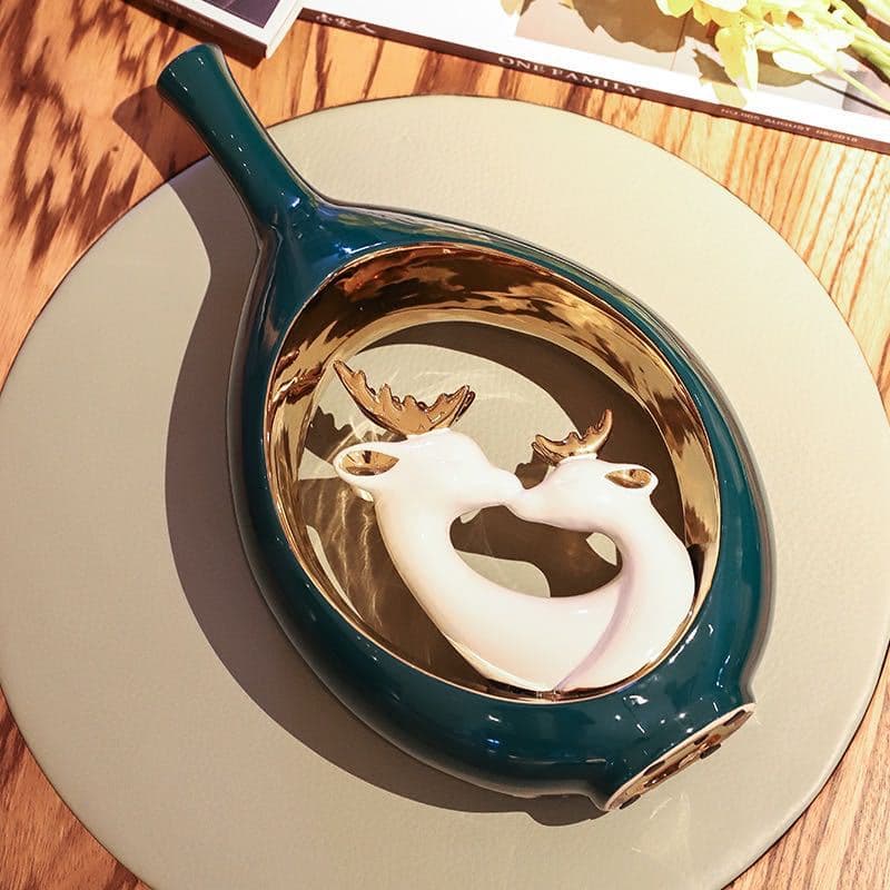 Top view of teal swan ceramic vase with metallic accent artwork