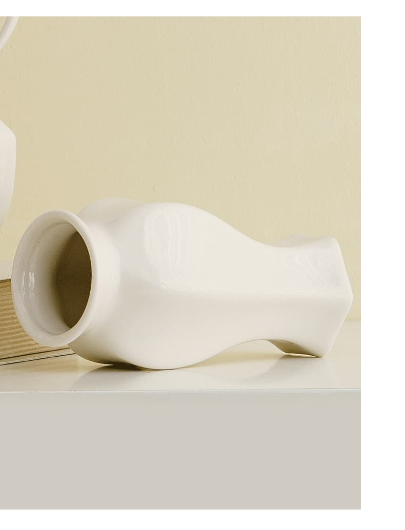 Gloss white ceramic vase detail shown on its side